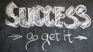 The chalk board illustration of success and go get it.