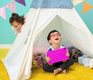 Children in a tent happily holding their LeapPad 2 explorer kid's tablet.