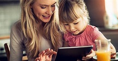 The picture of a Mother and Daughter engaging their fun learning tablet.